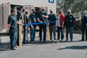 YLWD Board and YL City Council cut a large ribbon in front of the elk mountain natural gas generator