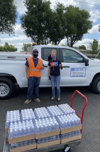 YLWD Team Member Donating Water bottles to PATH-OC