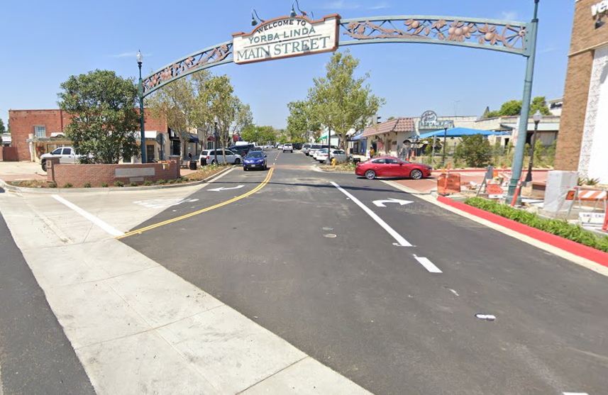 entrance to Main Street, Yorba Linda. Arched sign reads" Welcome to Yorba Linda Main Street"