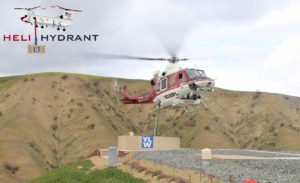 Santiago Heli-hydrant with logo and OCFA helicopter hovering