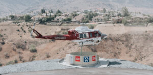 OCFA helicopter lowering snorkel into wells fargo Heli-hydrant