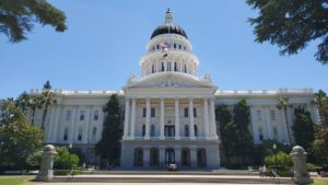 the california state capitol building under a blue clear sky