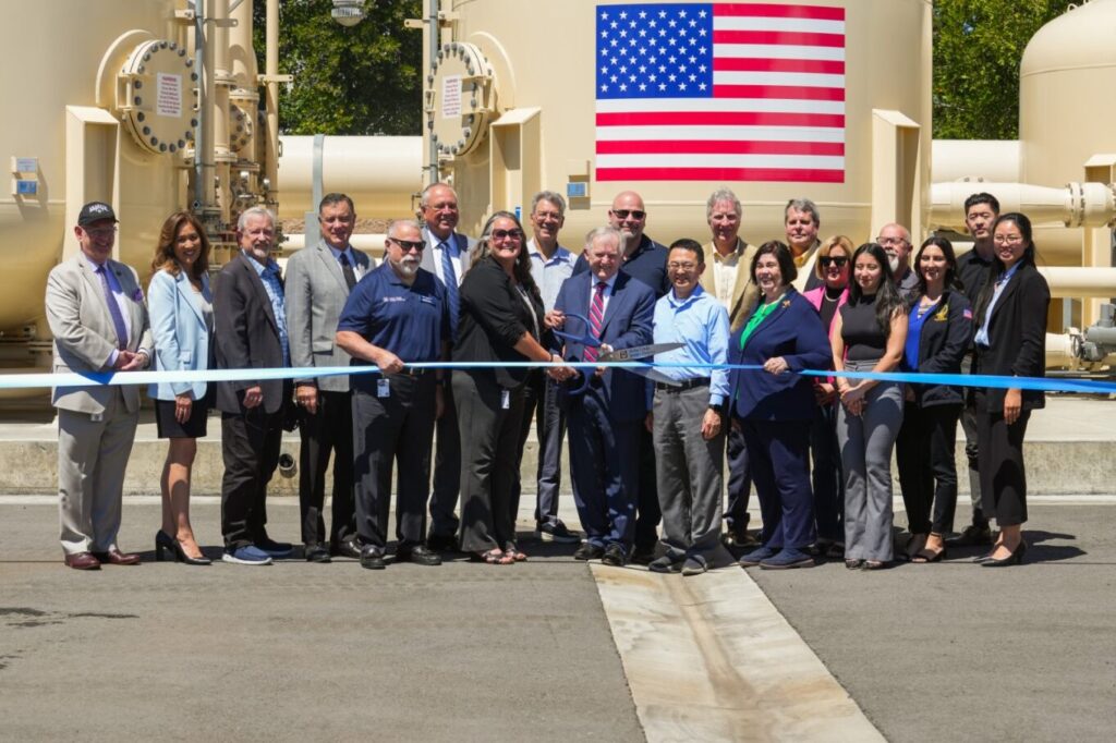 Members from YLWD, OCWD, and local elected officials pose in front of the J. Wayne Miller, Ph.D Water Treatment Plant.