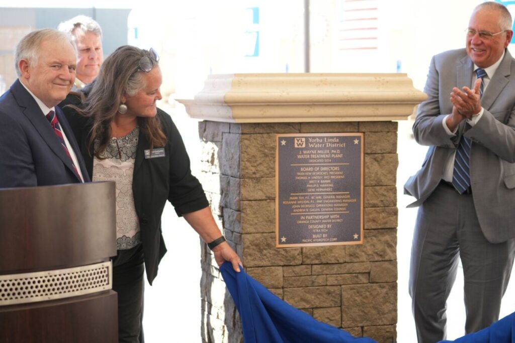 YLWD Board President Trudie DesRoches unveils Dr. Miller's plaque
