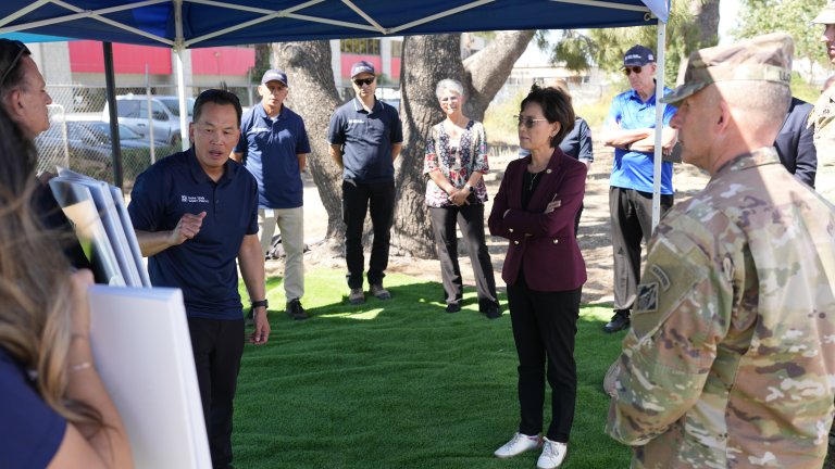 Congresswoman and YLWD staff look at a water supply graphic during a well project tour