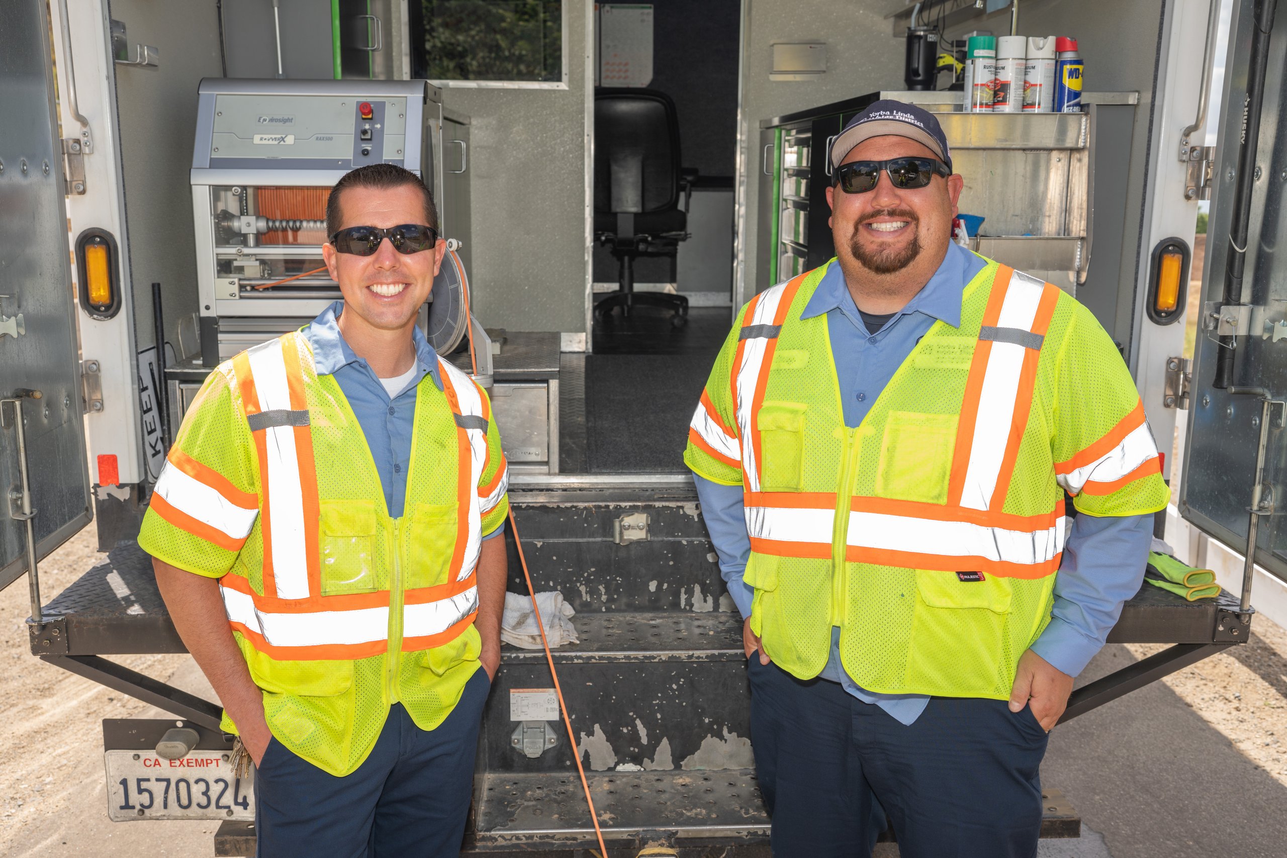 District staff posed in the back of sewer inspection van
